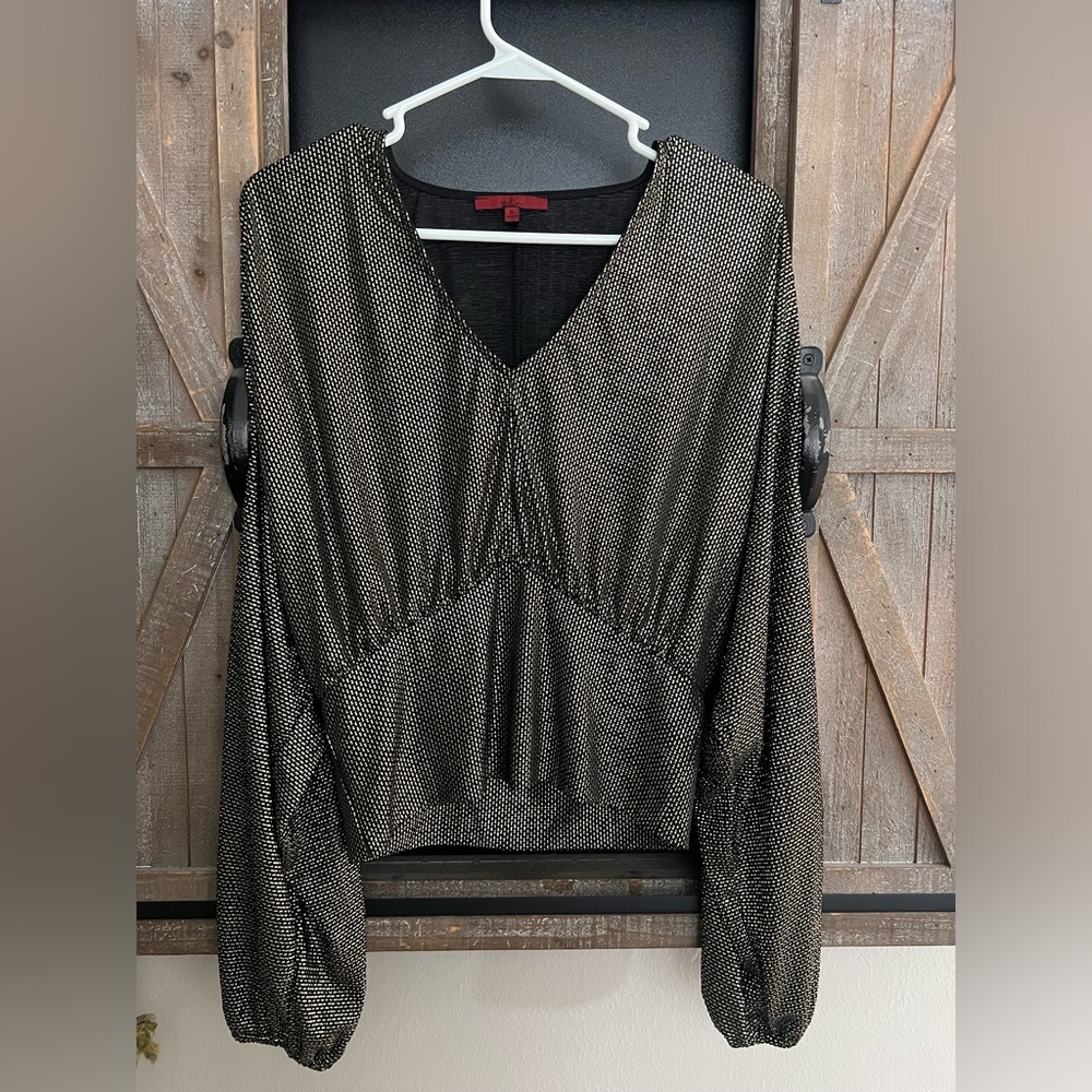 Beautiful black and gold top from Buckle. Washed once, never worn.